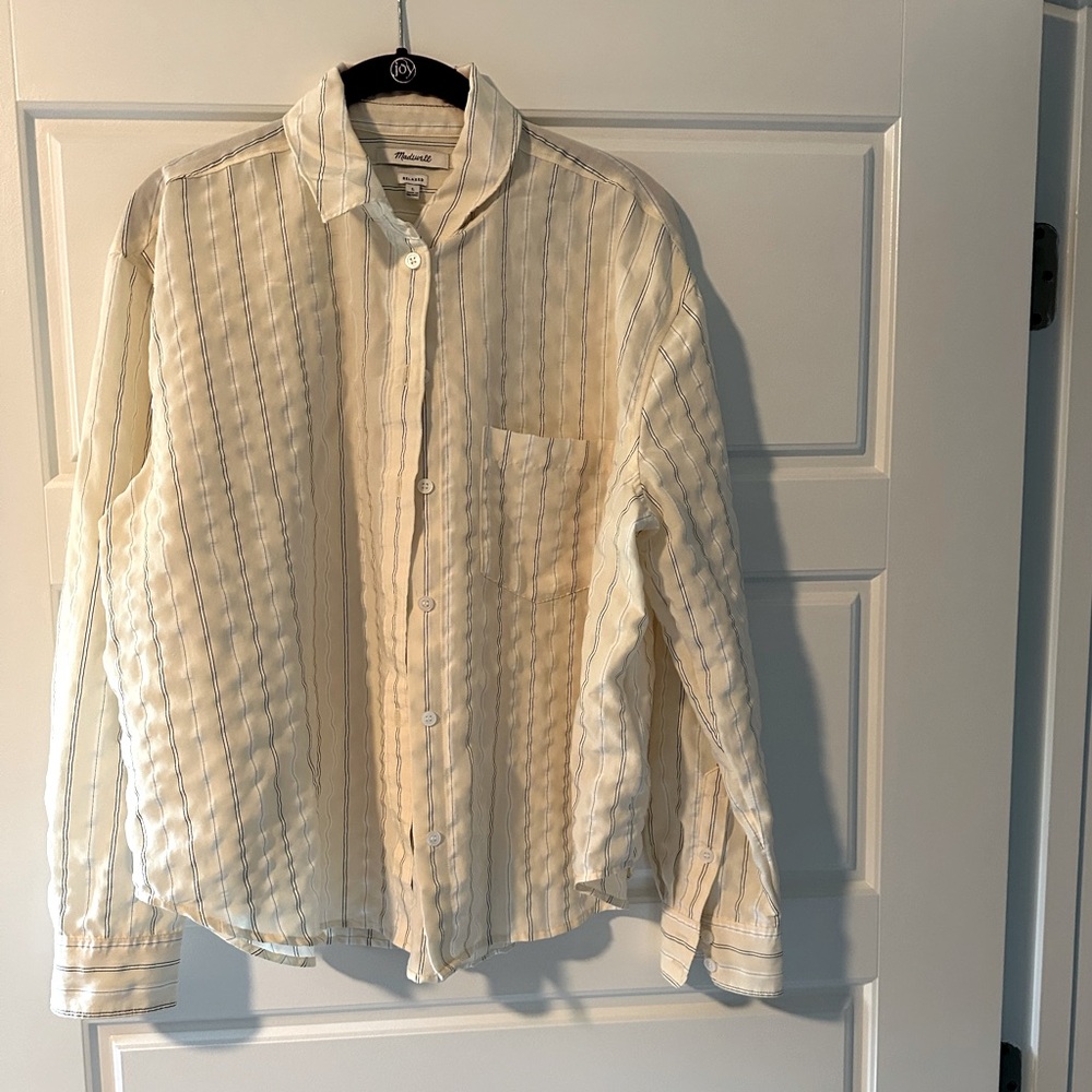 Relaxed fit long sleeve button shirt.